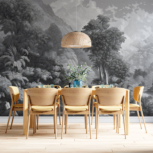 Dining area with wooden chairs and a table against a forest mural.