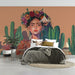 Creative home office with a vibrant floral and cactus mural wall as a professional backdrop