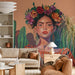 Boho-style living room featuring a desert portrait wall mural behind a leather sofa