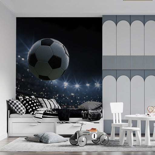 A bedroom featuring a stadium soccer mural behind a modern gaming setup