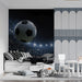 A bedroom featuring a stadium soccer mural behind a modern gaming setup