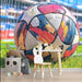 Sporty playroom wall mural with a stylized soccer ball graphic