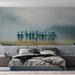 A quiet bedroom reading area featuring the misty abstract figures as a sophisticated, moody accent wall.