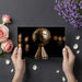 Bronze soccer trophy held by hands with flowers and petals on a dark surface