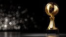 Gold trophy with a blurred bokeh background