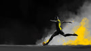 Soccer player in action with a dynamic pose against a dark background with yellow accents