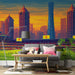 A living room with a large stadium mural behind a sleek dark sofa and a flat screen TV.