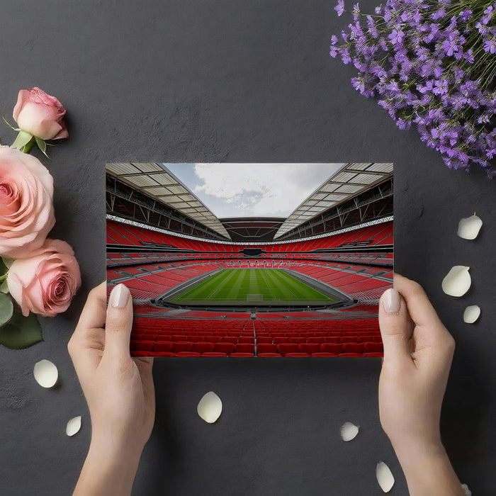 Empty Stadium Red Seating Mural Wallpaper | Symmetrical Interior, Clean Pitch, High-Contrast Red and Green