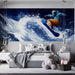 Modern bedroom with a large wall mural of a snowboarder and decorative items on the bed.