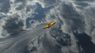 Yellow kayak on a body of water with cloud reflections
