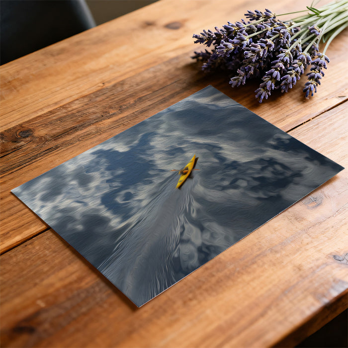 Placemat with a kayak design on a wooden table with lavender.