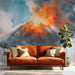 Dramatic erupting volcano wallpaper featured on a bedroom accent wall.