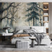 Home office with dark forest wallpaper and wood desk accents for a cozy, grounded workspace