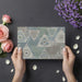 Folk-inspired triangle mural in a cozy reading nook with a plush armchair and minimalist decor.