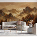 Panoramic mountain landscape mural behind a minimalist dark wood desk in a cozy home office.