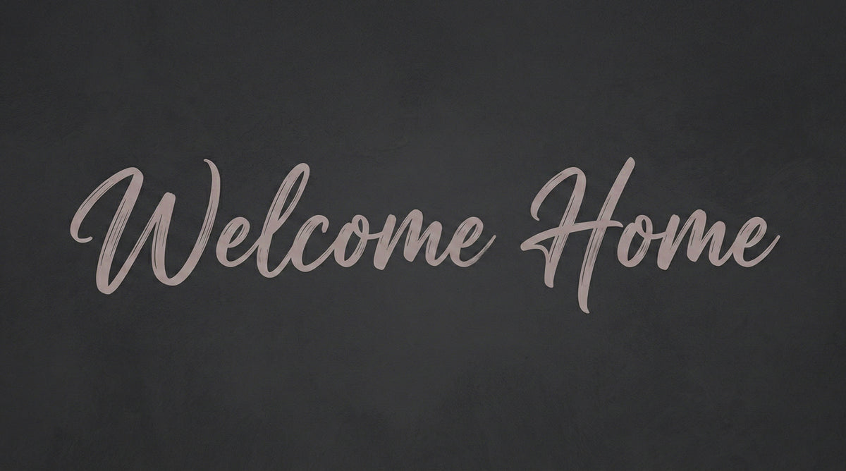 Welcome Home script in dusty mauve on a moody charcoal textured background