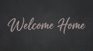 Welcome Home script in dusty mauve on a moody charcoal textured background