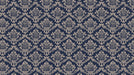 Ornate Victorian damask wallpaper pattern featuring intricate cream floral motifs on a deep navy blue background.