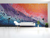Modern home office with a dynamic fluid art wallpaper backdrop.
