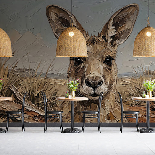 A cozy study room with the kangaroo mural installed as a feature wall behind a rustic timber desk.