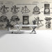 Study room featuring navigation instrument wallpaper with antique wooden desk and brass lamp