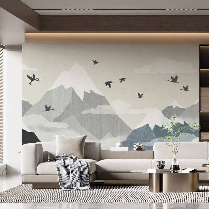 A bright bedroom featuring a mountain landscape wallpaper behind a wooden bed frame and neutral bedding.