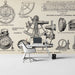 A study room with a large, clean wall mural showing detailed antique navigation tools on a classic aged paper background.
