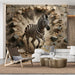 A playful brick wall mural featuring a zebra in a home office or creative studio space.