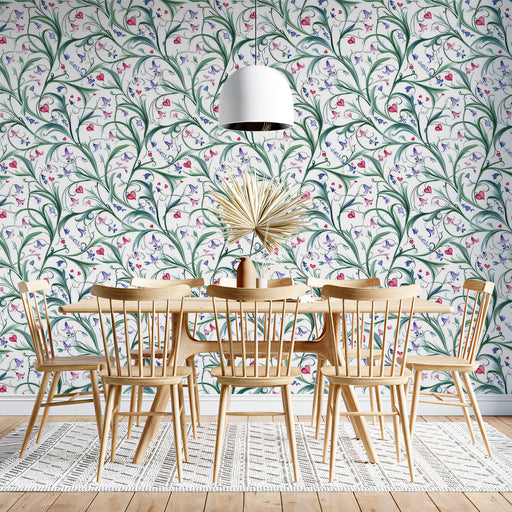 Flowing nature-inspired mural wallpaper as a feature wall in a cozy home office setup