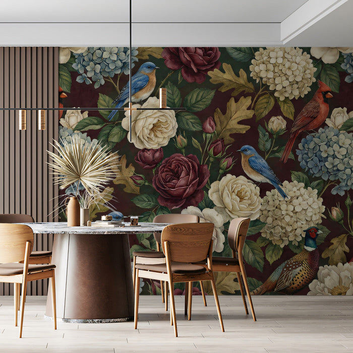 Moody floral bird wallpaper installed as a feature wall in a cozy home library with dark wood shelving