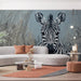 Zebra portrait wallpaper installed in a modern living room with neutral gray furniture
