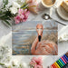 An elegant study area with a textured artistic flamingo wallpaper behind a wooden desk.
