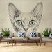 Close-up of the cat mural installed in a minimalist home office with dark wood desk and neutral decor