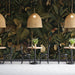 Dark botanical jungle mural featuring exotic animals in a modern dining room