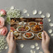 A bright, open-plan kitchen area adorned with a high-detail food mural wallpaper, ideal for a culinary-focused home.