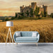 A tranquil bedroom space featuring a landscape mural of a castle at sunset, creating a peaceful sanctuary