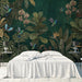 Moody tropical botanical mural installed as a feature wall in a sophisticated bedroom