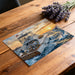 A home office with a dramatic deep sea fishing mural behind a wooden desk.
