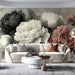 A refined home library or study room with a vintage floral mural that provides an artistic backdrop for bookshelves.