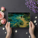 A home study room with an impressionistic meadow landscape mural, providing an inspiring backdrop for focus and reading.
