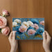 Living room wall featuring blue and pink painterly floral wallpaper