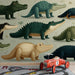 A bright kid's bedroom featuring a playful crocodile mural behind a wooden crib.