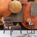 Contemporary dining room with a copper and charcoal geometric feature wall and minimalist furniture
