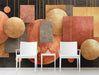 Modern living room featuring geometric mural with suspended copper shapes and dark charcoal walls