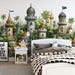 A bright playroom area with a sprawling castle and forest mural as the central focal point.