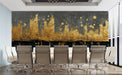 Living room interior featuring a gold and charcoal cityscape mural behind a dark velvet sofa
