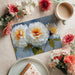 Large-scale peony mural featured in a contemporary dining room with neutral furniture