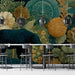 A moody and stylish dining room decorated with a dark forest botanical and bear wallpaper