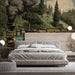 Scenic steam train wall mural featured in a spacious living room with antique decor and warm lighting.
