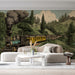 Vintage train mountain mural installed on a feature wall in a cozy home study with a dark wood desk.